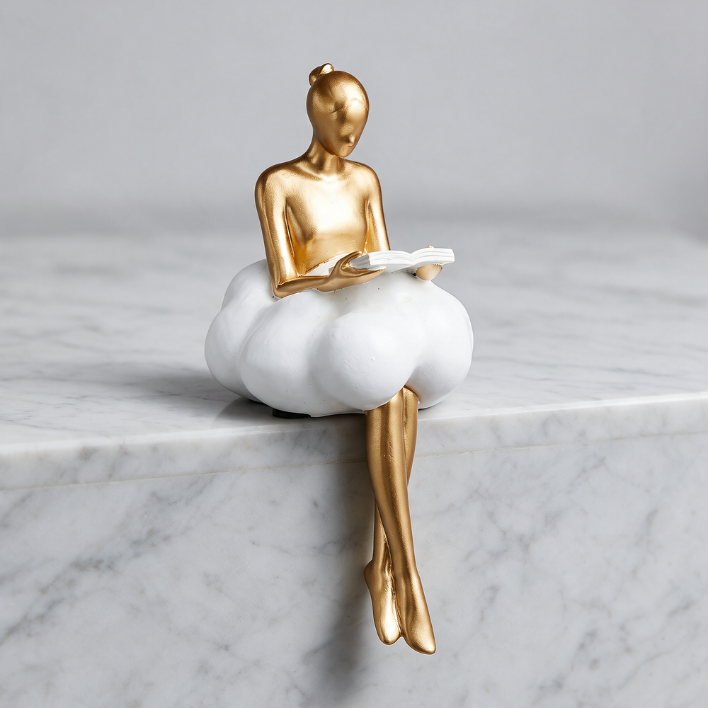 Nordic Girl Keepsake Statuette - Read A Book on marble surface