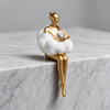 Nordic Girl Keepsake Statuette - Holding The Ball on marble surface