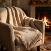 Blanket draped over armchair near fireplace