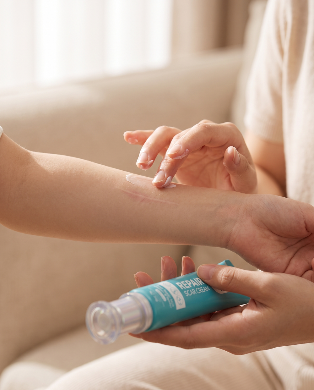 Gently applying Ceramide Scar Repair Cream to another person's arm