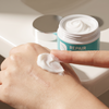 Close-up of Ceramide Scar Repair Cream being applied to hand