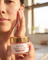 Applying Dragon Blood Gel Cream to cheek